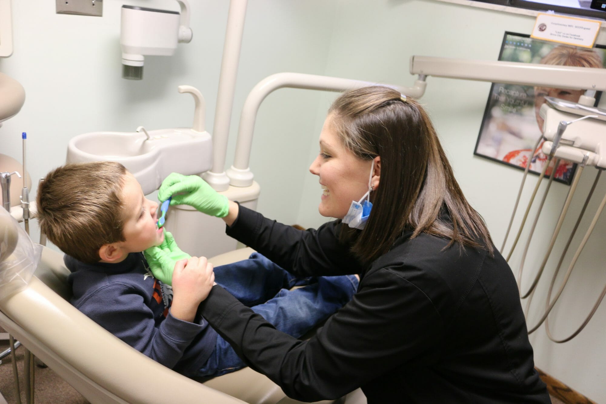 Showing Boy how to brush teeth