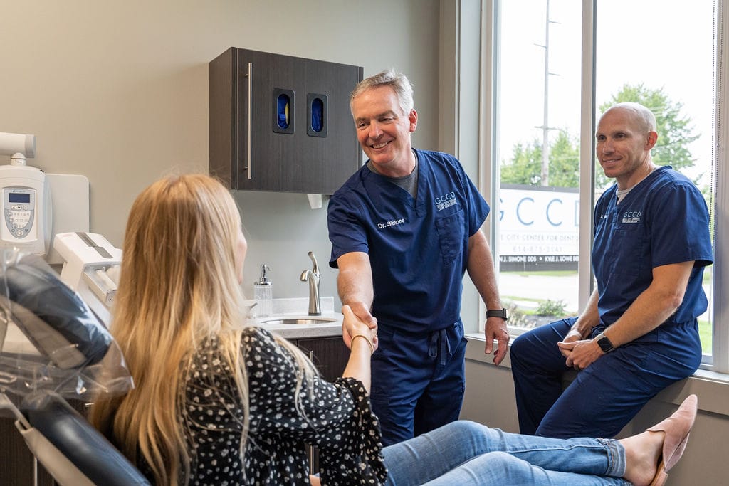 Dentists talking to a patient