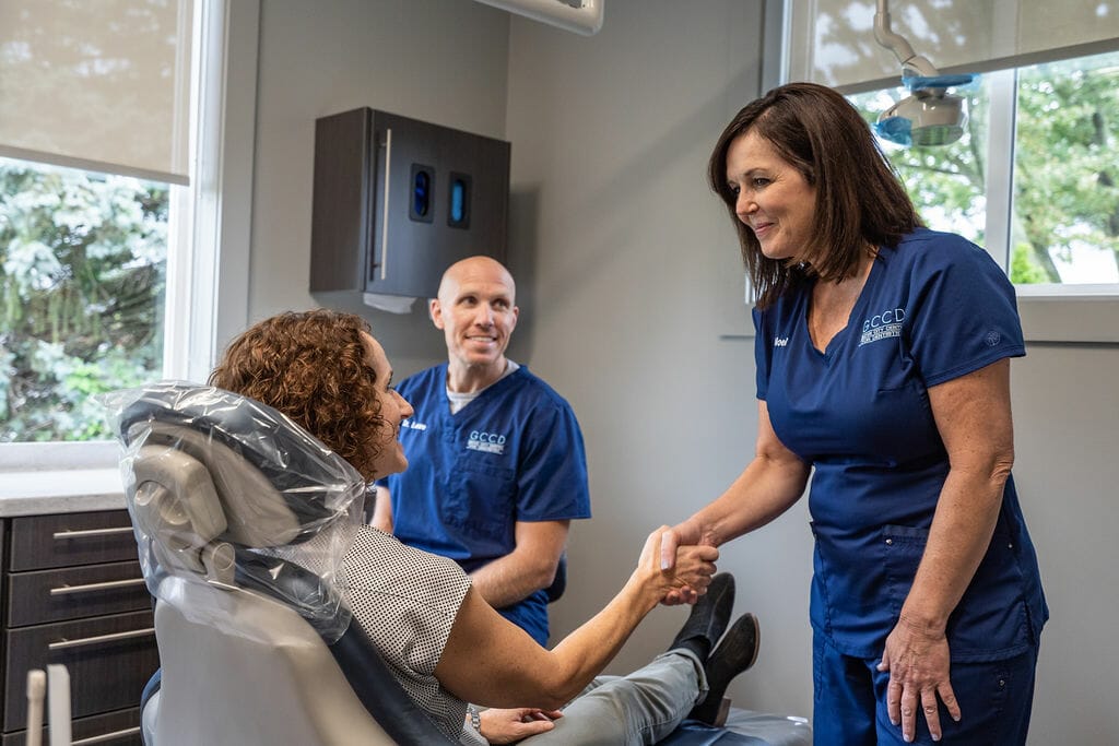 Shaking hands with patient
