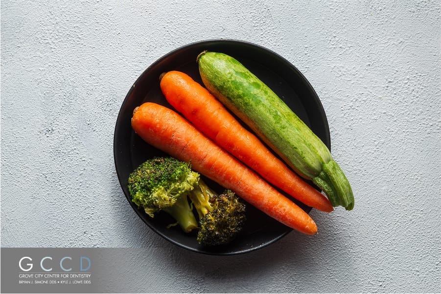 Fresh carrot and cucumber on a white background